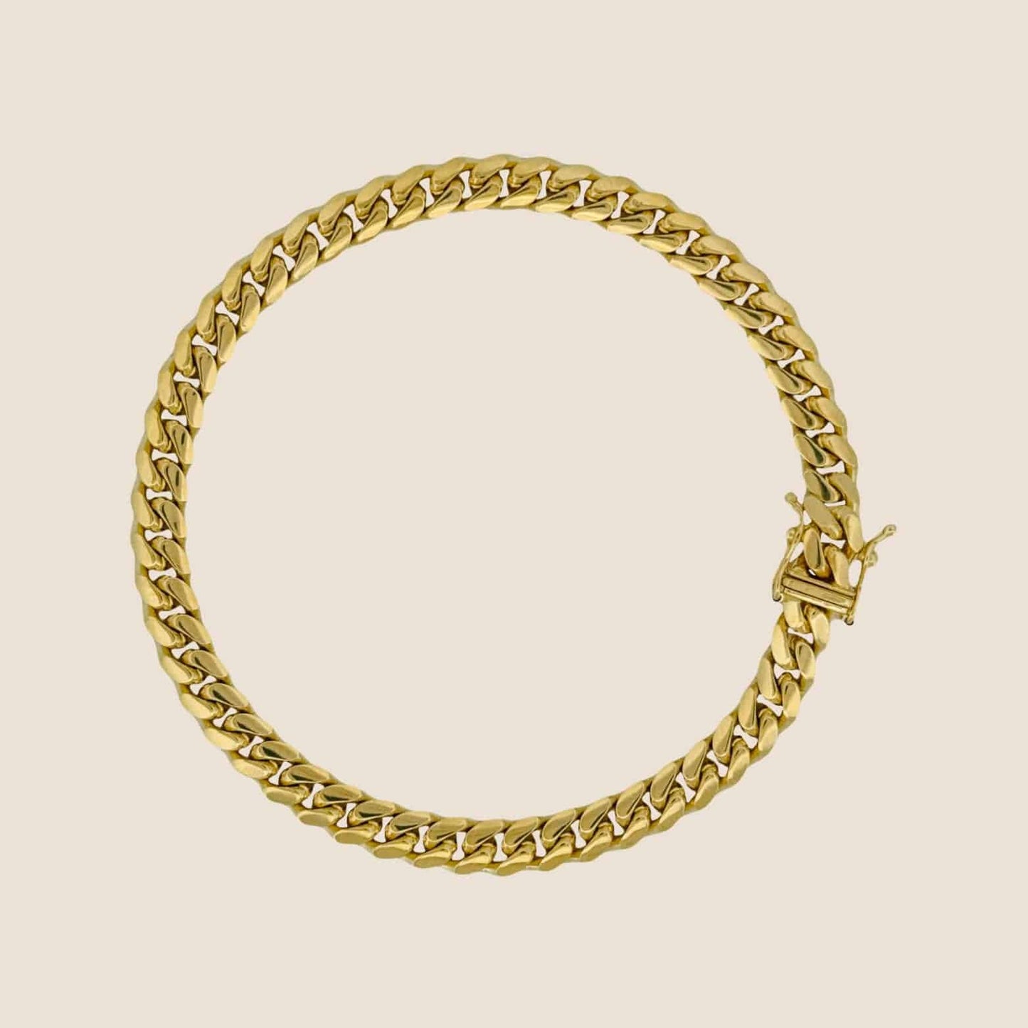 6MM Miami Cuban Link Bracelet in 14k solid gold with interlocking links and a secure box clasp, made in Italy