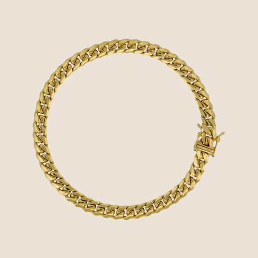 6MM Miami Cuban Link Bracelet in 14k solid gold with interlocking links and a secure box clasp, made in Italy