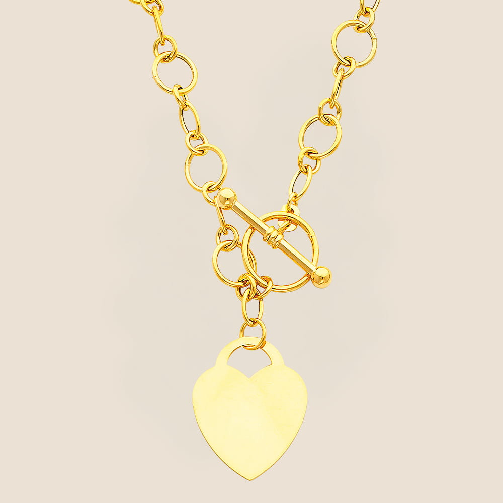 yellow gold necklace with heart pendant and a toggle clasp