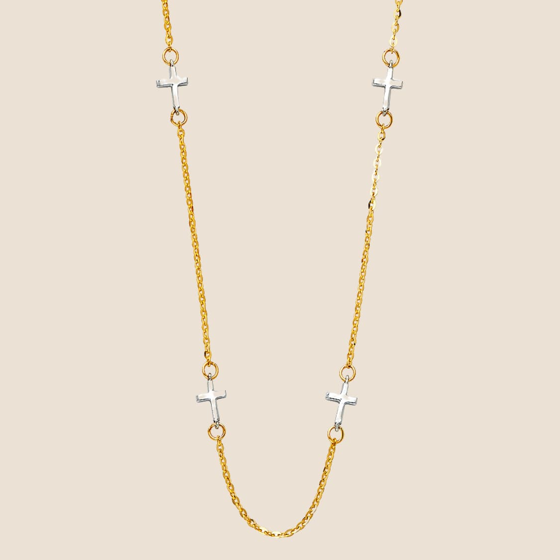 Gold necklace with delicate chain adorned with four small white gold crosses, adjustable size 17" + 1", 14k gold, made in USA.