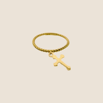 Twisted yellow gold band ring with hanging cross charm, contemporary jewelry design in 14k gold