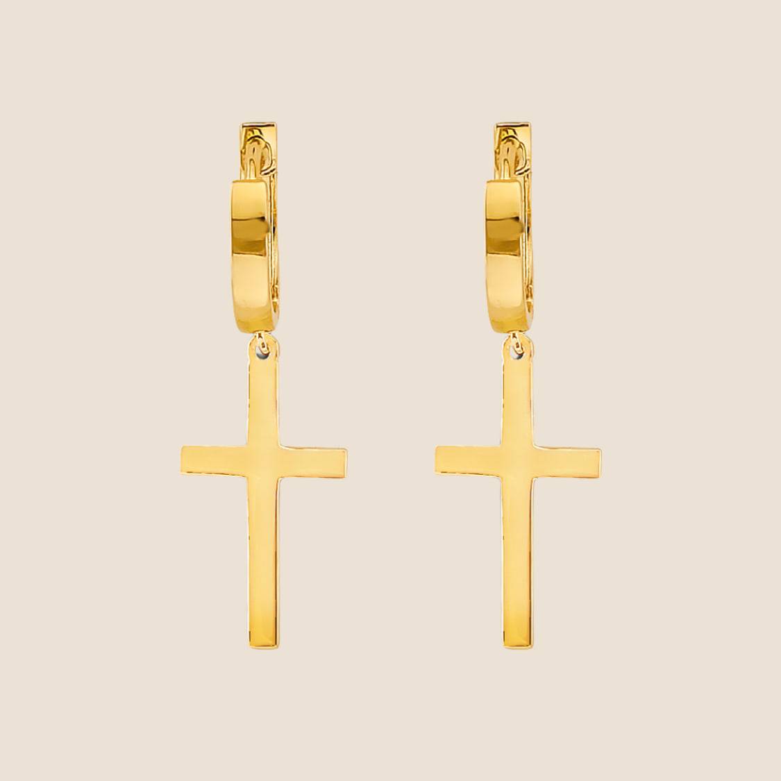 14k gold cross huggies earrings with sleek cross pendants.