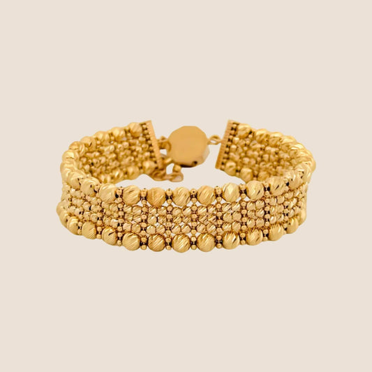 Kin Stone Cut Bracelet with golden beads, 14k gold lobster clasp, and an adjustable length, displaying luxurious texture and opulent shine.