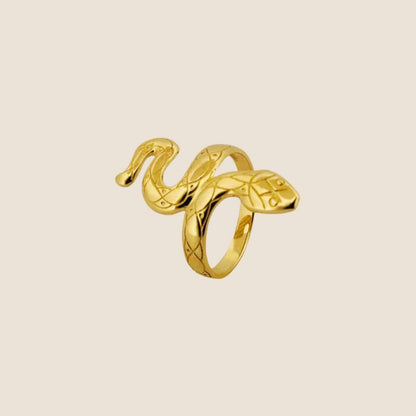 14k gold slithering snake ring with intricate patterns, elegantly wrapped around the finger.