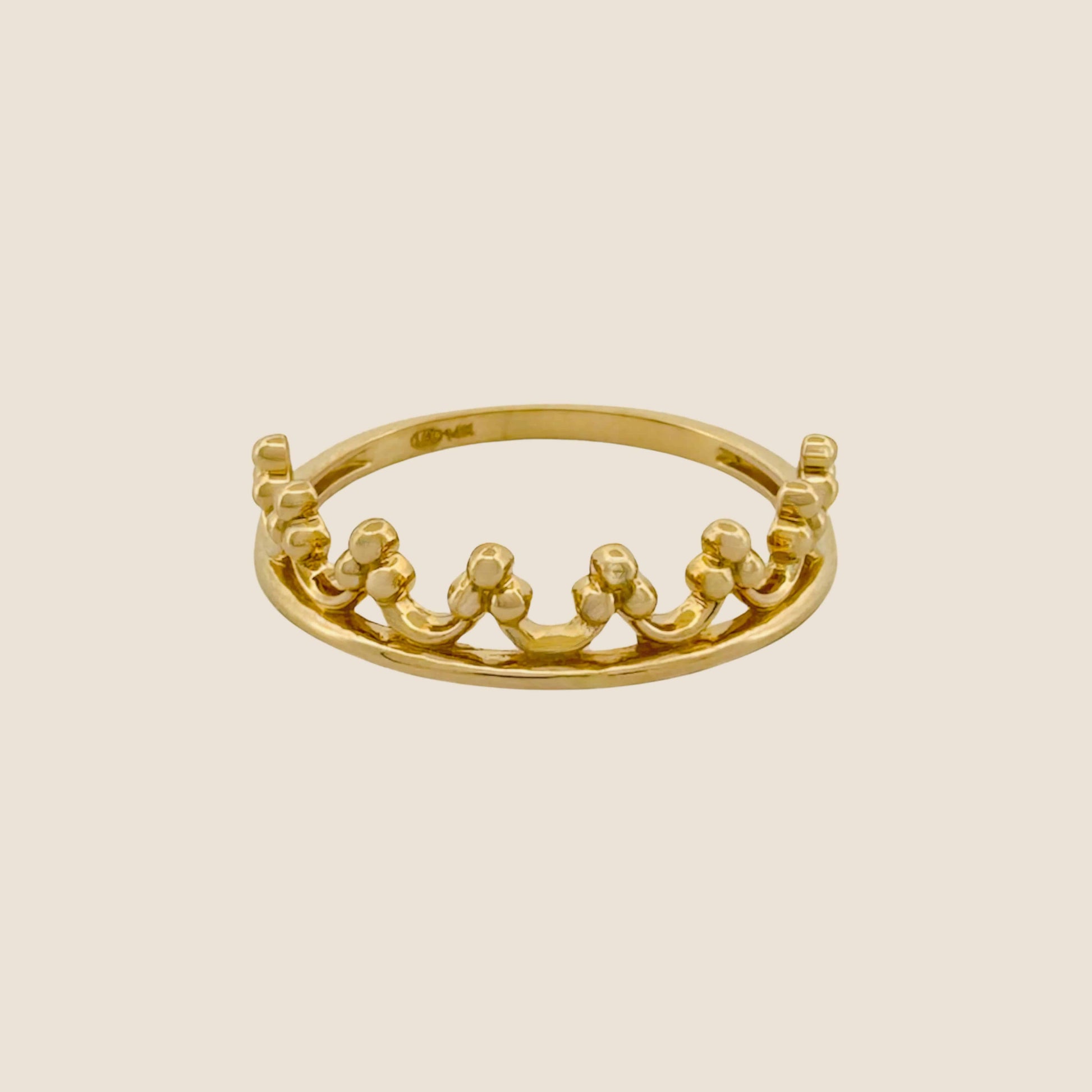 Beaded Tiara Ring in 14k yellow gold with crown-like design and elegant beaded accents on a beige background.