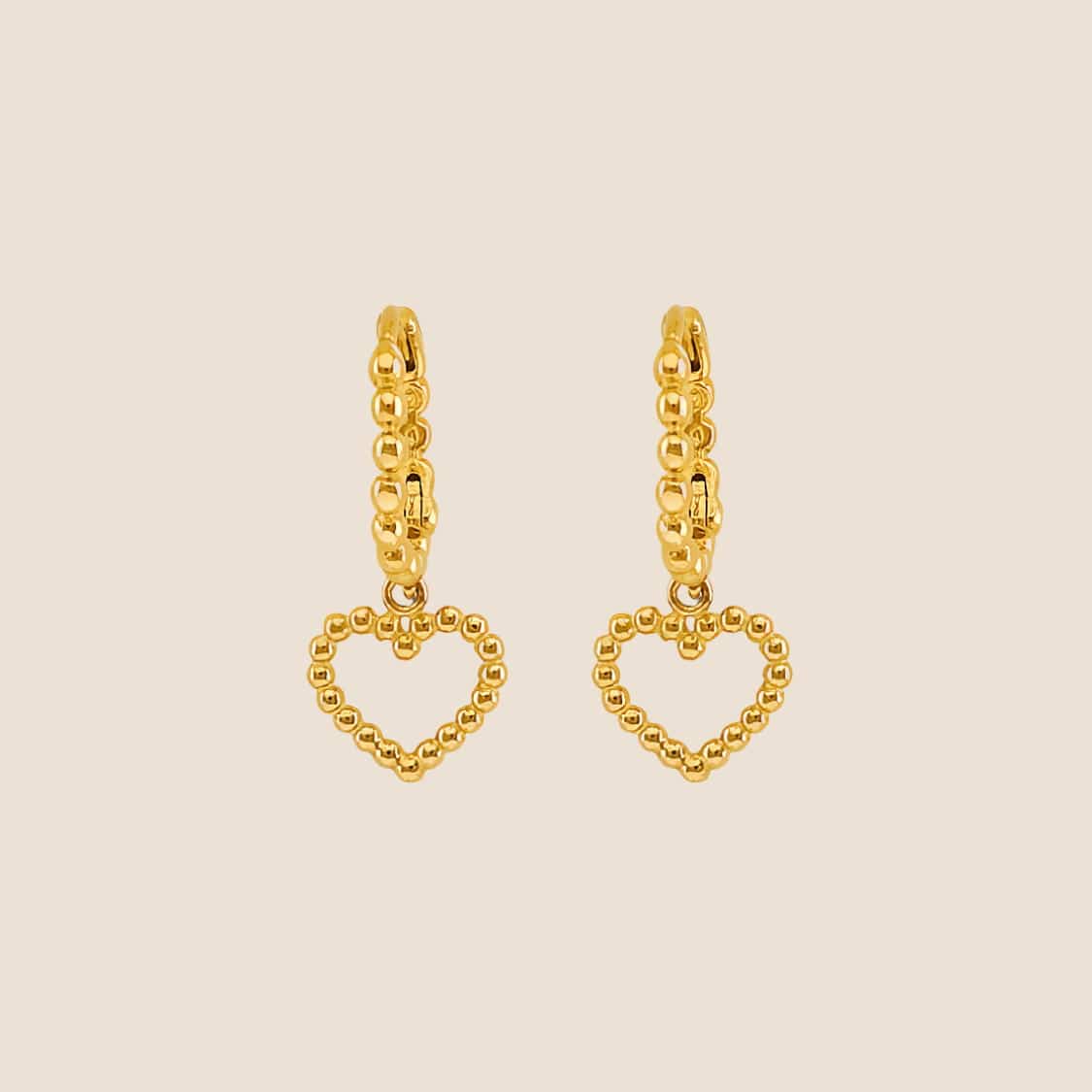 Gold bead heart huggie earrings with delicate heart-shaped pendants dangling from the hoops, 14k gold made in USA.