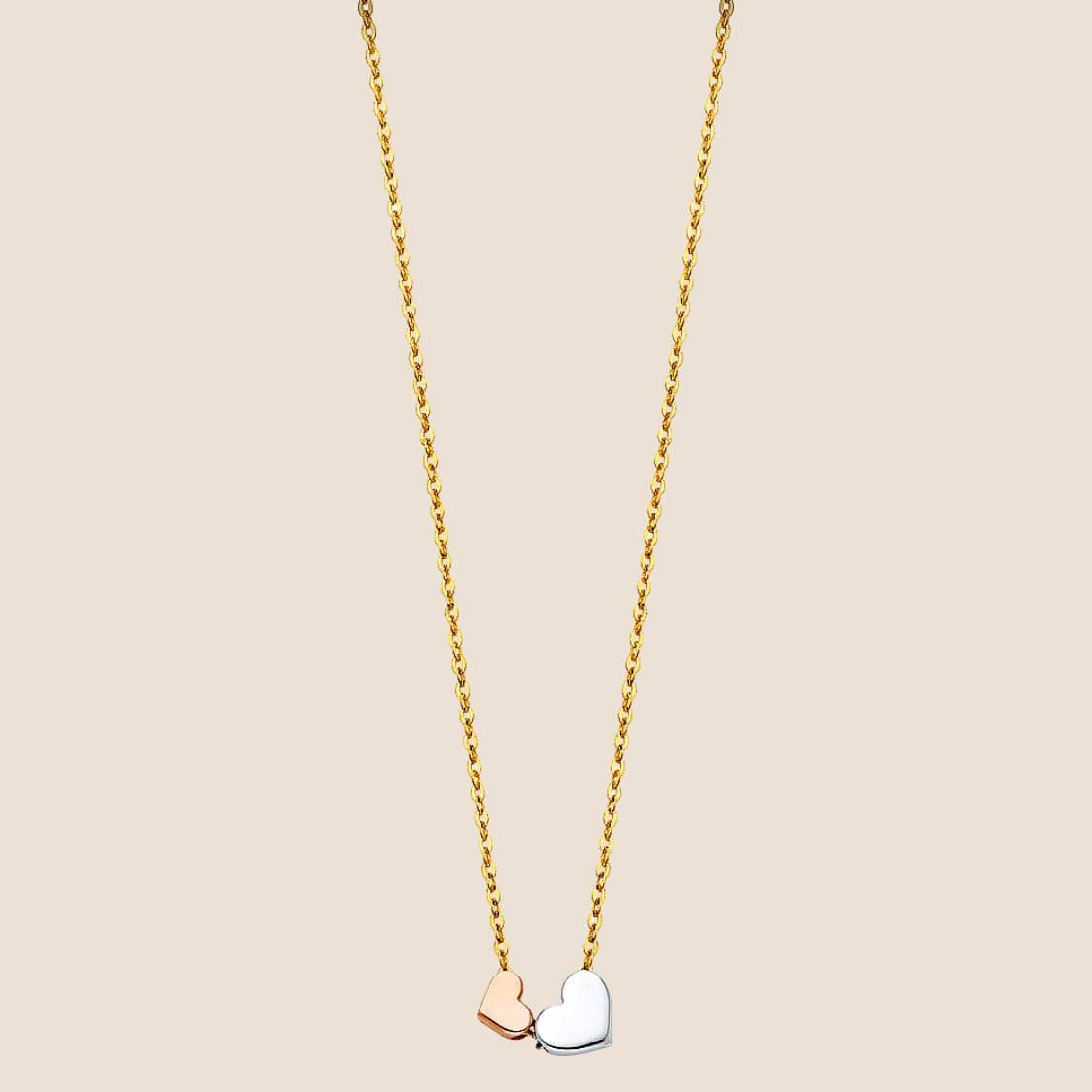 Two Hearts Necklace with intertwined rose gold and white gold heart pendants on a 14k gold chain. Adjustable length 17" + 1". Made in USA.