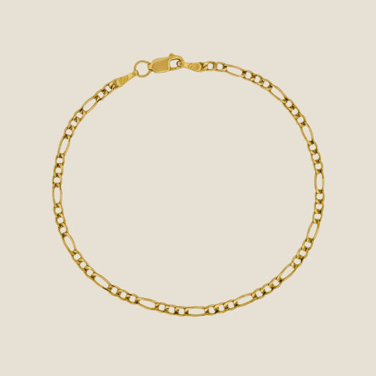 2.5MM Figaro Bracelet in 14k gold with lobster clasp, featuring a modern and elegant chain link design, ideal for layering or individual wear