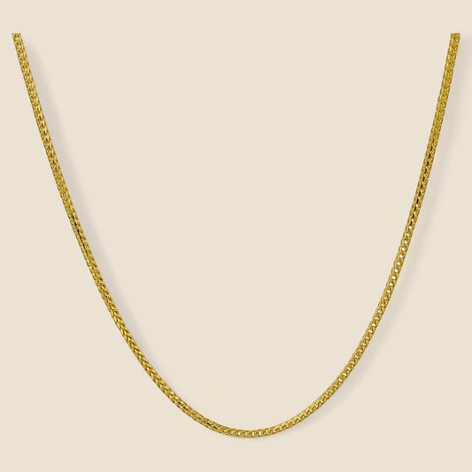 1.5MM Franco Chain necklace in 14k solid gold with diamond cut design and lobster clasp, showcasing elegant and refined style, made in Italy