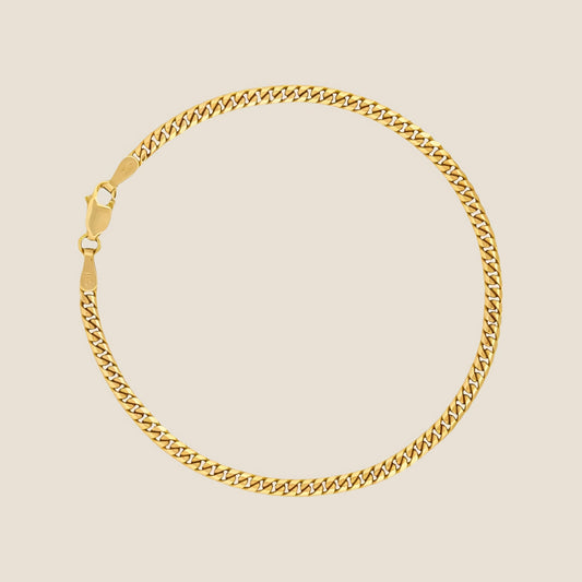 3MM Miami Cuban Link Bracelet in 14k solid gold with a lobster clasp, made in Italy. Lightweight and comfortable wear with distinctive appeal