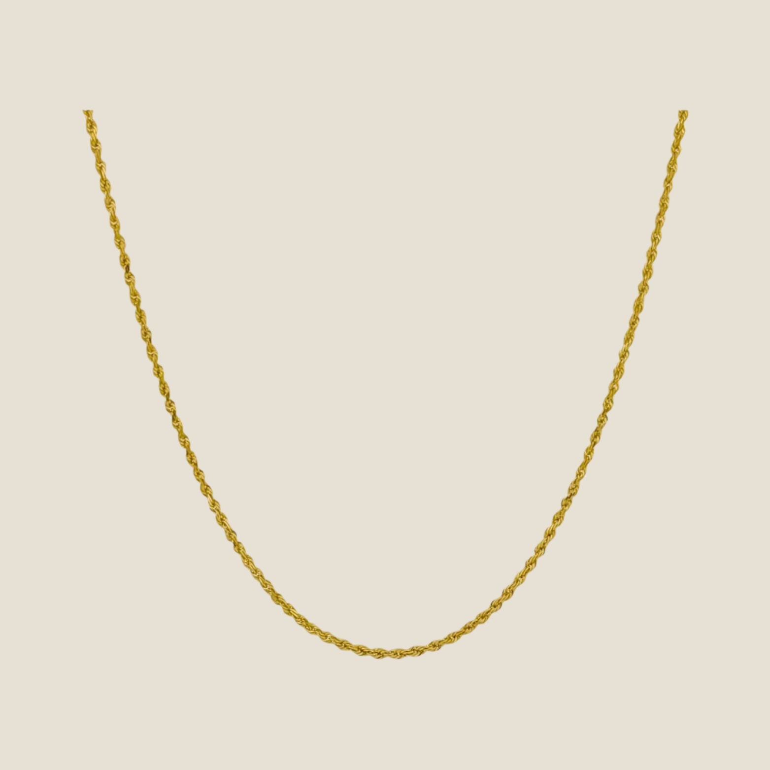 1MM Rope Chain 14k solid gold rope chain with diamond cut design and lobster clasp, made in Peru, displayed on a neutral background.