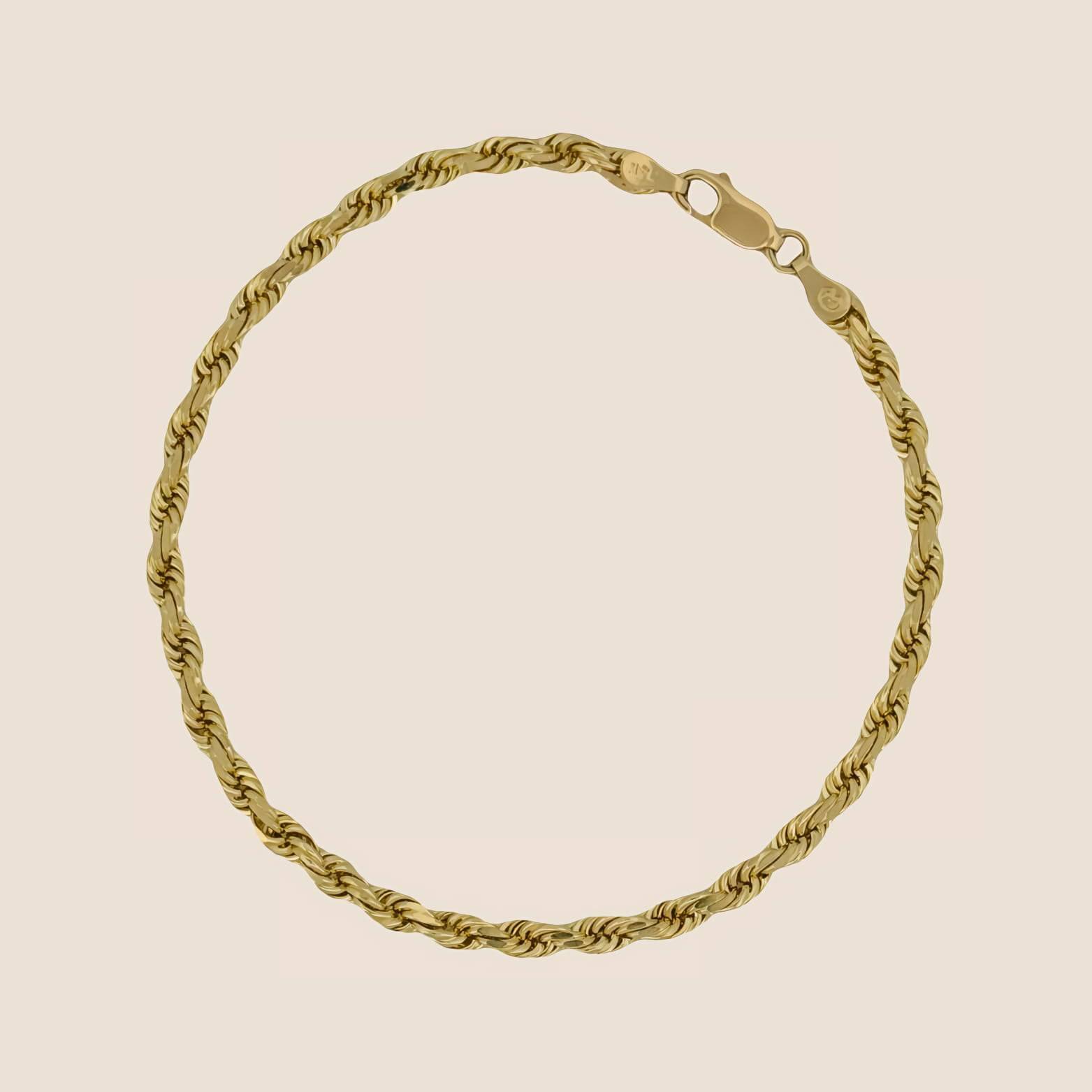 4MM Rope Bracelet in 14k solid gold with lobster clasp. Elegant jewelry piece made in Peru, reflecting light beautifully with every movement.