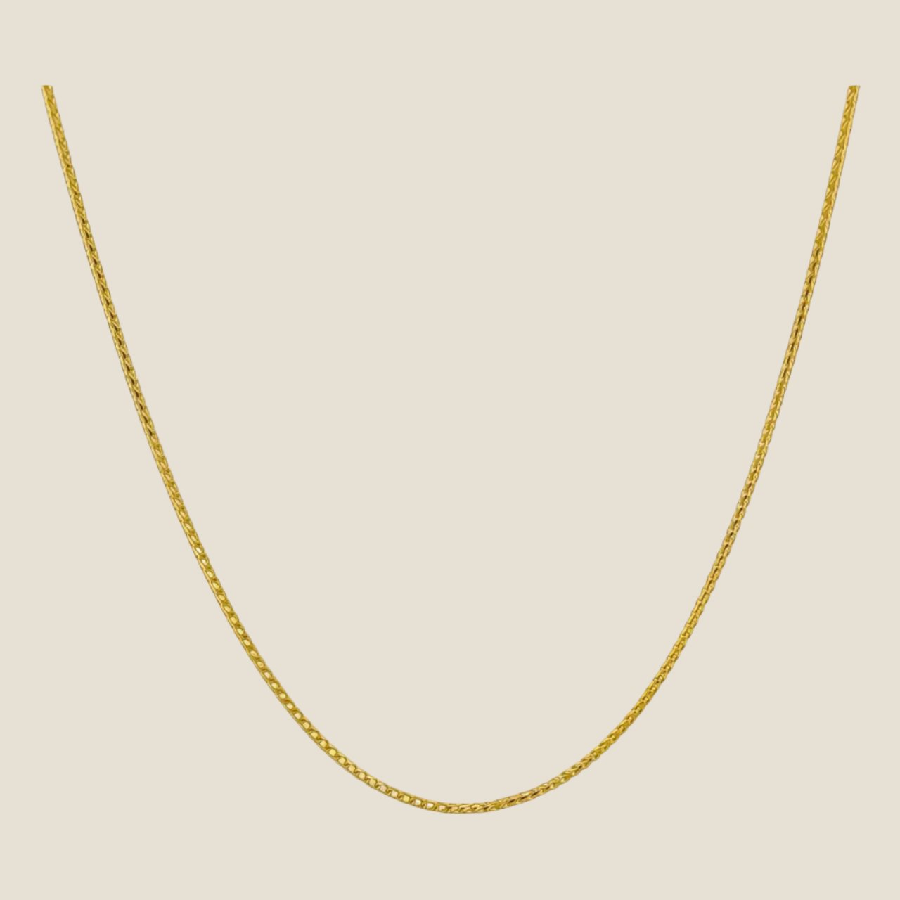 1MM Franco Chain in 14k solid gold with smooth, interlocking links and a lobster clasp, perfect for layering or solo wear, made in Italy