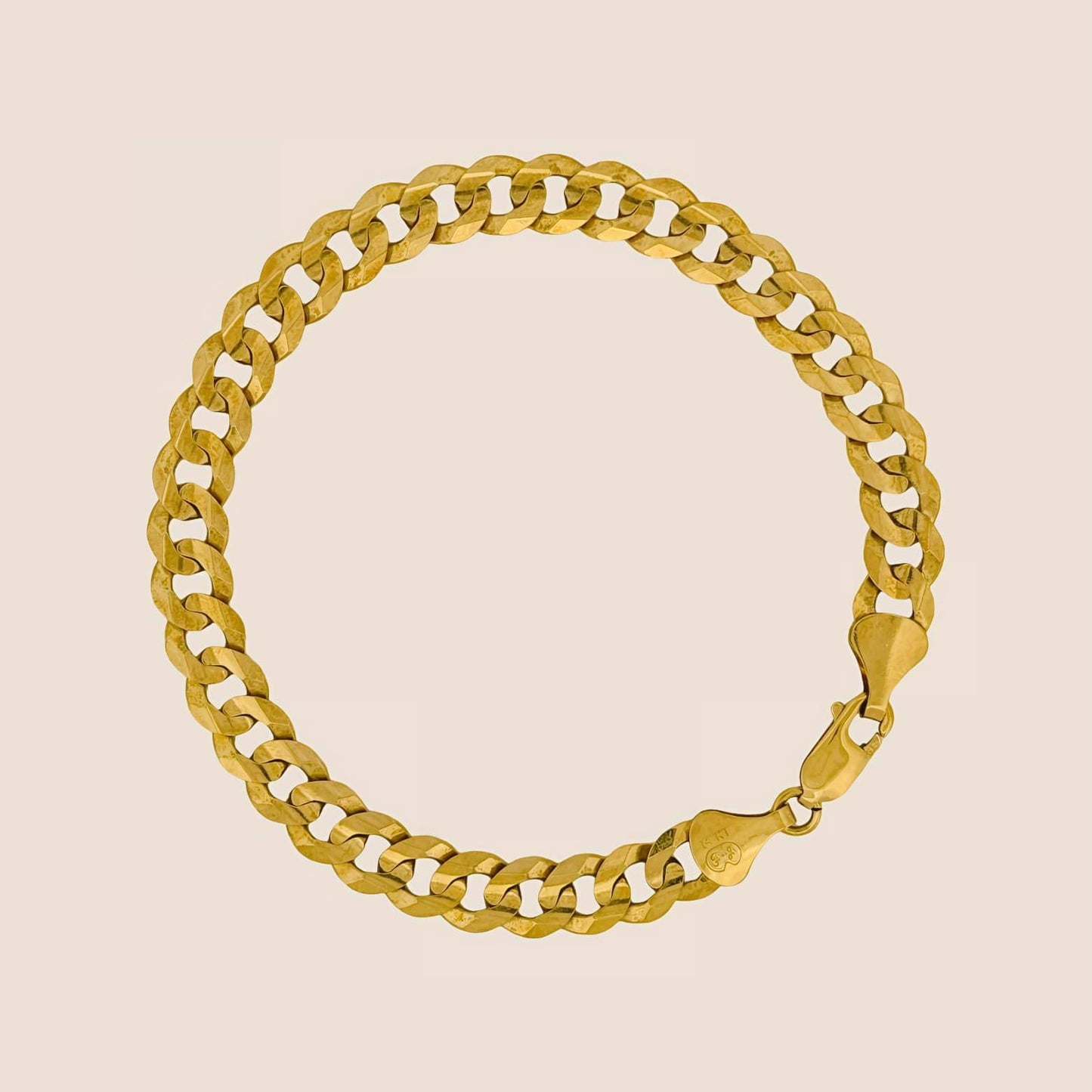 8MM gold curb chain bracelet with secure lobster clasp, classic and timeless 14k gold accessory, made in the USA.